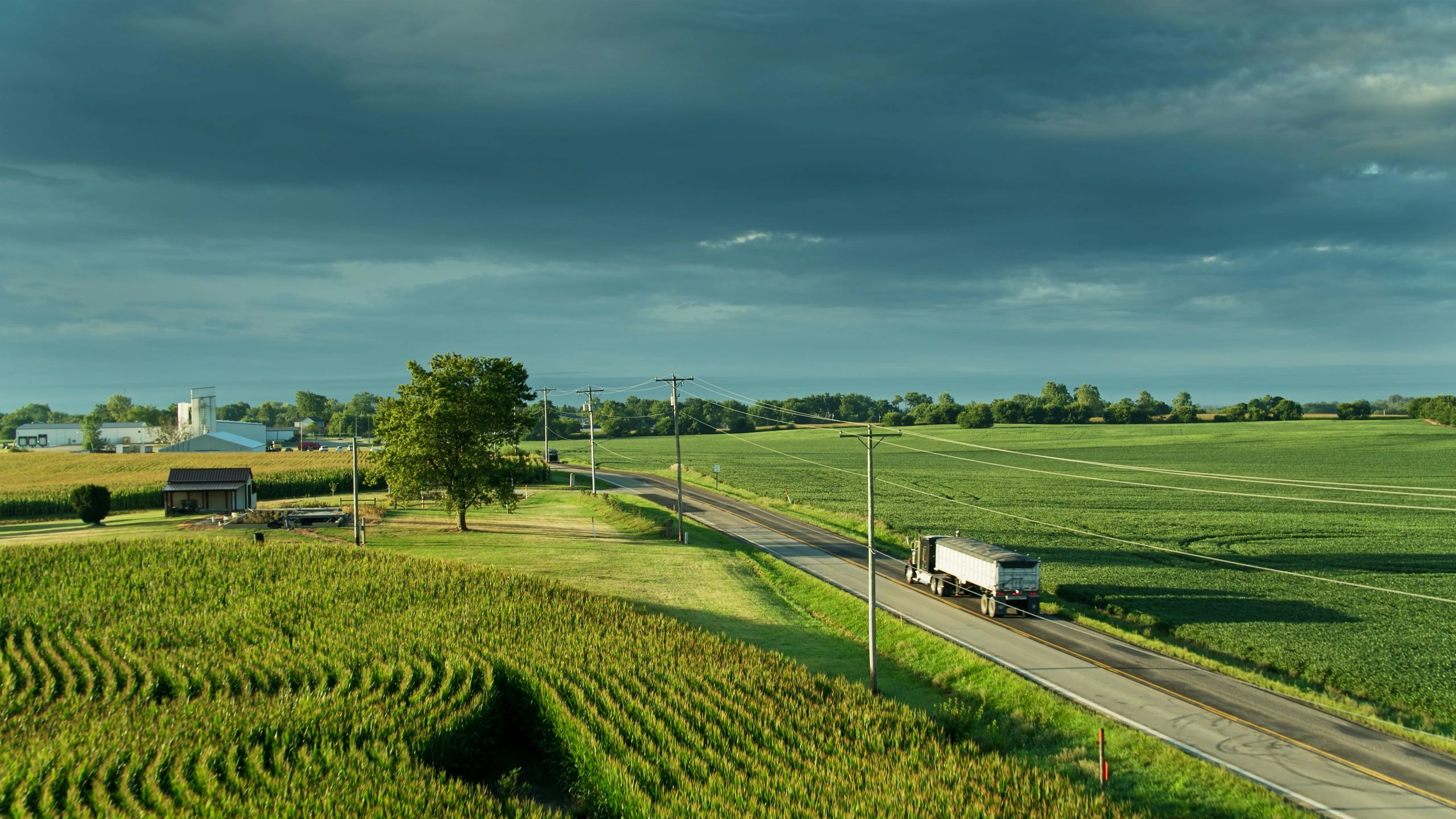 Agricultural transport and farmland representing supply chain quality